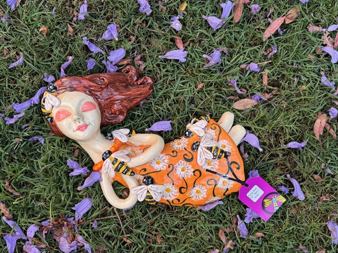 Flying Wall Girl with Daisy dress and bees